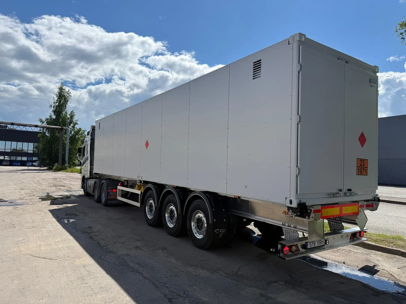 Rear view of an ADR-marked 40 ft HC CNG transport container on its trailer